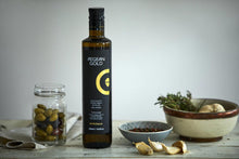 Load image into Gallery viewer, Greek extra virgin olive oil Aegean Gold in black glass bottle 500ml. Olive oil with garlic, herbs and tomatoes. 
